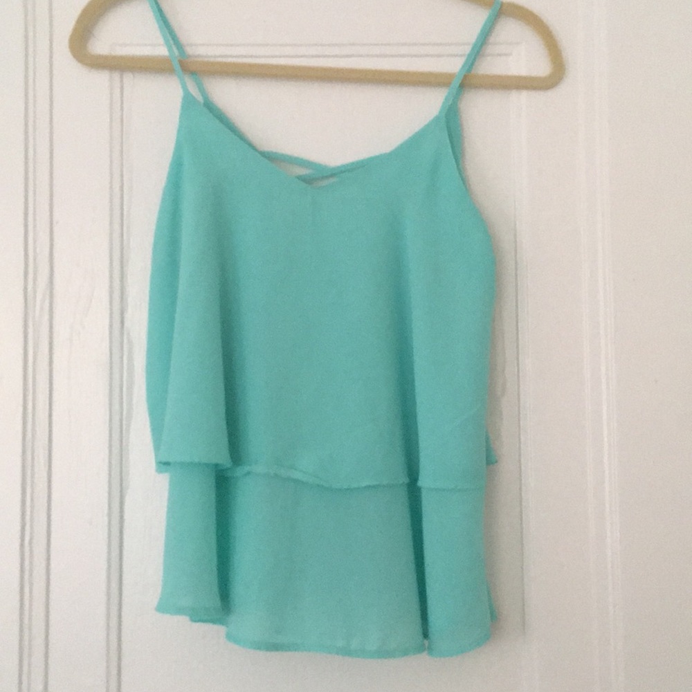Francesca’s turquoise flowy tank